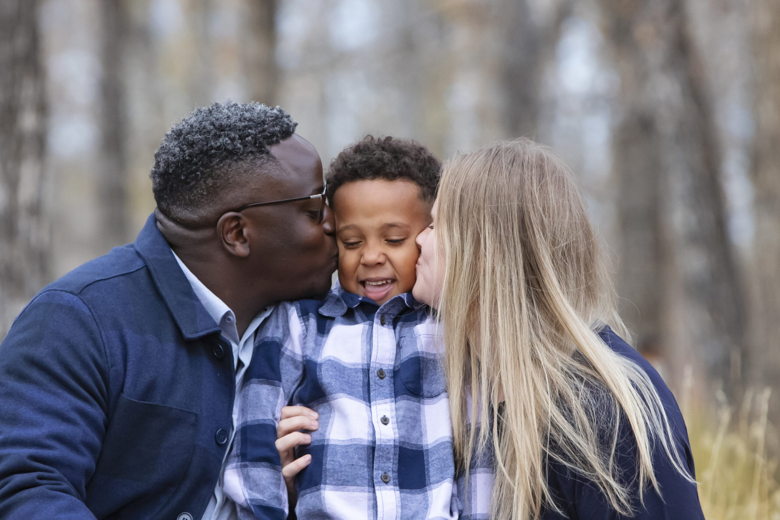 Family portraits in the fall with bundled up clothes in Calgary Alberta