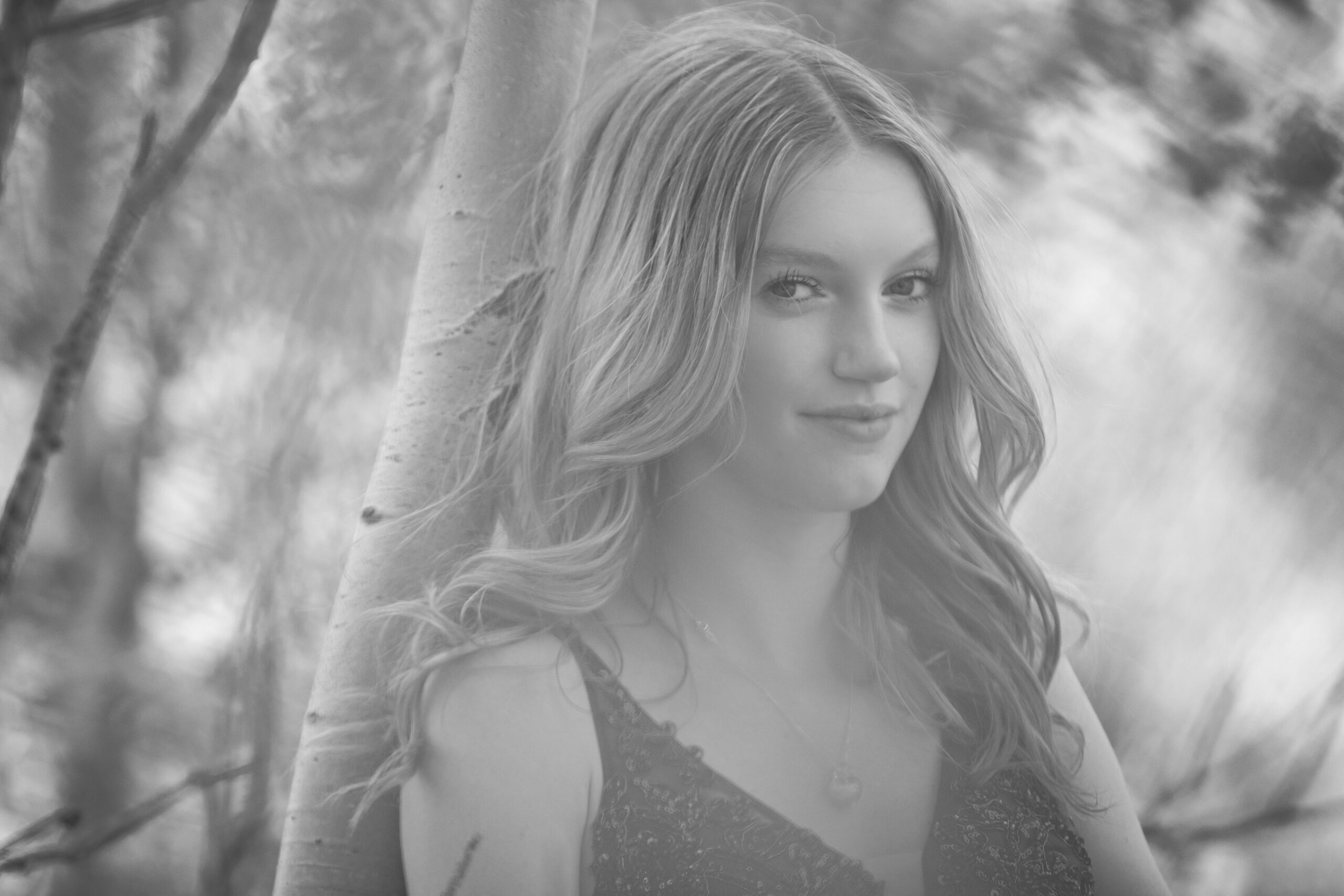 Gorgeous grad with a smirky smile in black and white. Photo in Alberta Canada